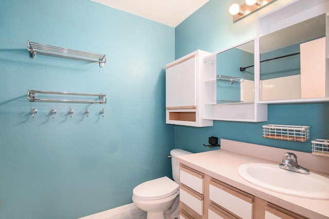 18372 N Ridge Ct Unit 12, Spring Lake, MI 49456 - full bath with toilet, vanity, and baseboards