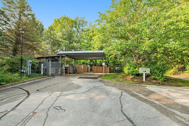 18372 N Ridge Ct Unit 12, Spring Lake, MI 49456 - view of vehicle parking featuring a detached carport and asphalt driveway