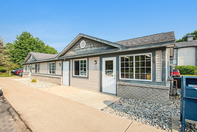18372 N Ridge Ct Unit 12, Spring Lake, MI 49456 - ranch-style house with brick siding and a patio area