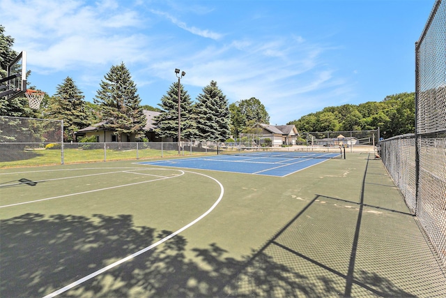 18372 N Ridge Ct Unit 12, Spring Lake, MI 49456 - view of basketball court featuring a tennis court and community basketball court