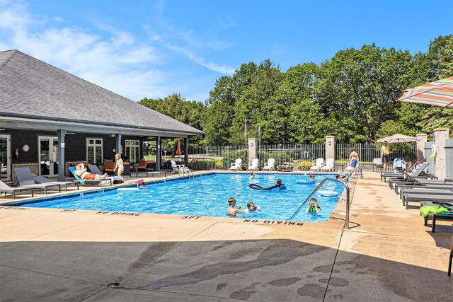 18372 N Ridge Ct Unit 12, Spring Lake, MI 49456 - community pool with a patio
