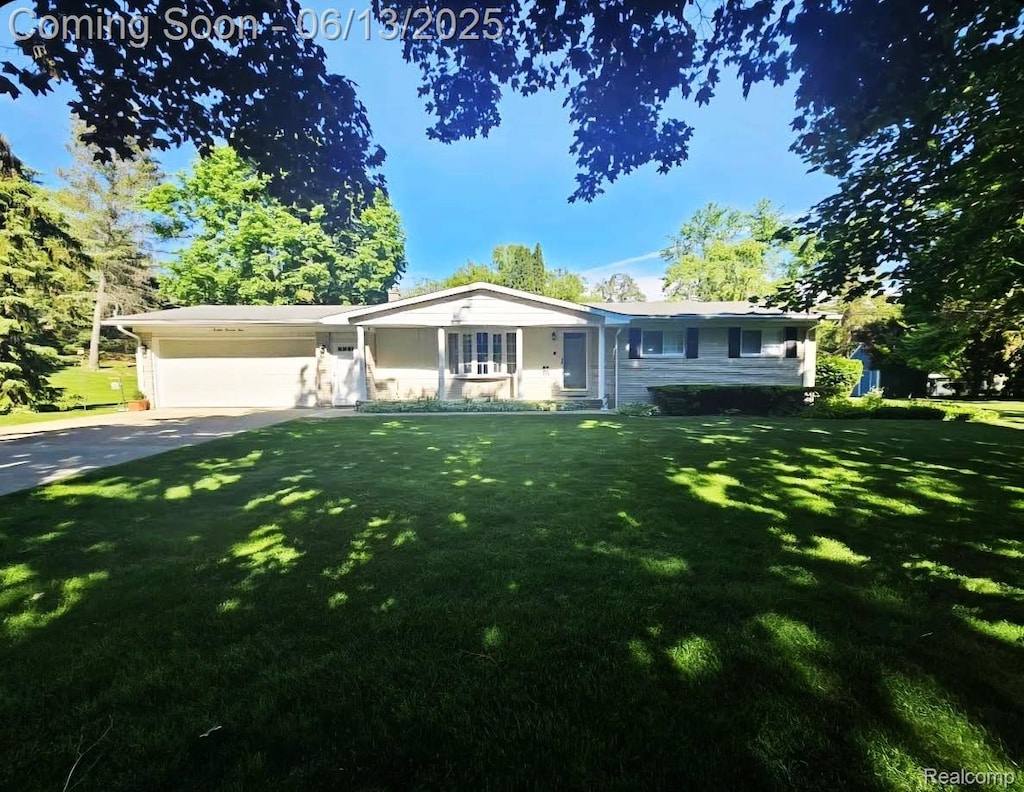 1674 Newark Ave, Pontiac, MI 48340 - single story home featuring an attached garage, a front yard, and concrete driveway