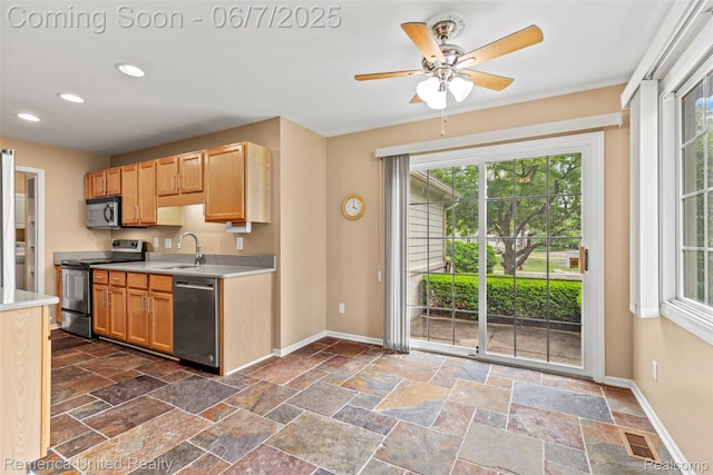 2663 Maple Forest Dr, Wixom, MI 48393 - kitchen featuring stainless steel appliances, baseboards, light countertops, and recessed lighting