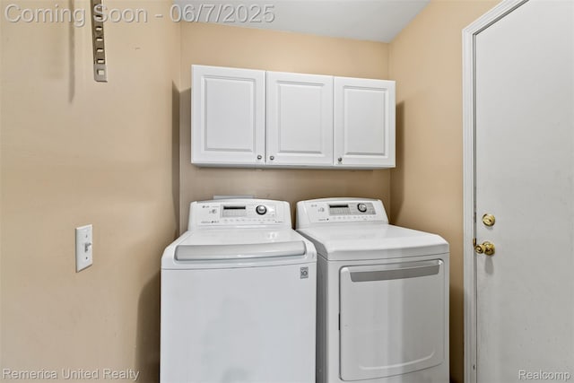 2663 Maple Forest Dr, Wixom, MI 48393 - laundry area featuring cabinet space and separate washer and dryer