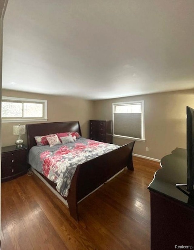 1616 Mark Hopkins Rd, Bloomfield Hills, MI 48302 - bedroom featuring multiple windows, wood finished floors, and baseboards