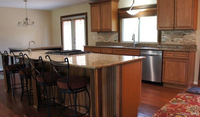 1616 Mark Hopkins Rd, Bloomfield Hills, MI 48302 - kitchen with dishwasher, a sink, gas cooktop, brown cabinets, and dark wood-style flooring