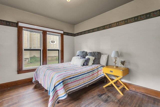 810 N Superior St, Albion, MI 49224 - bedroom featuring wood finished floors and baseboards