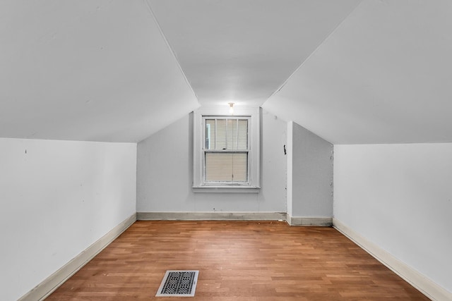 810 N Superior St, Albion, MI 49224 - bonus room featuring wood finished floors, baseboards, and vaulted ceiling