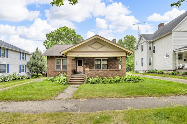 810 N Superior St, Albion, MI 49224 - view of front of property featuring brick siding and a front lawn