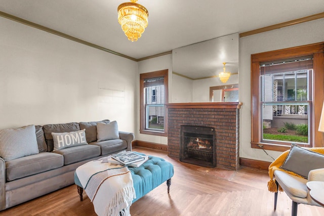 810 N Superior St, Albion, MI 49224 - living room featuring a chandelier, crown molding, a fireplace, and baseboards