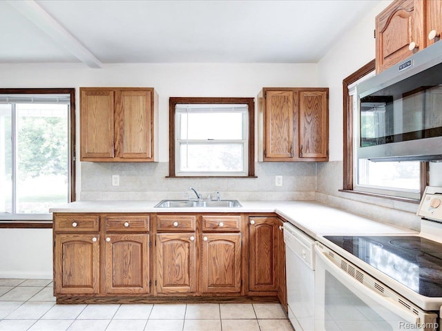 641 Michigan Ave, Marysville, MI 48040 - kitchen featuring white appliances, a sink, light tile patterned floors, and light countertops