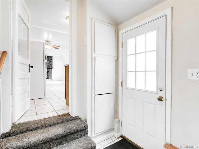 641 Michigan Ave, Marysville, MI 48040 - entryway featuring light tile patterned floors, a ceiling fan, lofted ceiling, and stairs