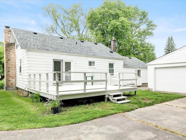 641 Michigan Ave, Marysville, MI 48040 - rear view of house featuring roof with shingles, a chimney, a deck, and a lawn