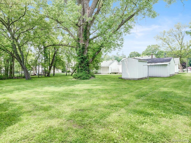 641 Michigan Ave, Marysville, MI 48040 - view of green lawn featuring an outdoor structure