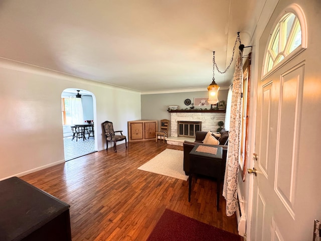 10073 Mcafee Dr, Montrose, MI 48457 - living area featuring wood finished floors, baseboards, and a glass covered fireplace