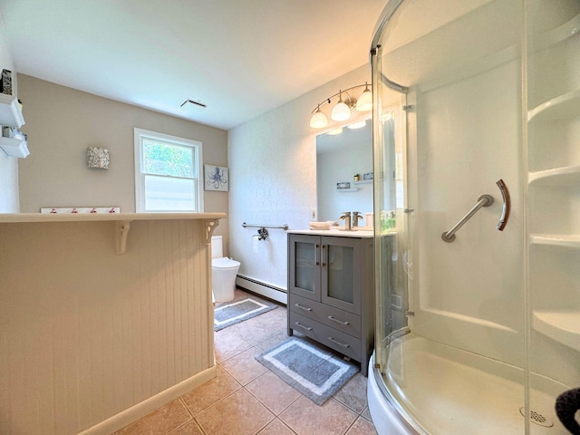 10073 Mcafee Dr, Montrose, MI 48457 - bathroom with baseboard heating, a stall shower, vanity, toilet, and tile patterned flooring