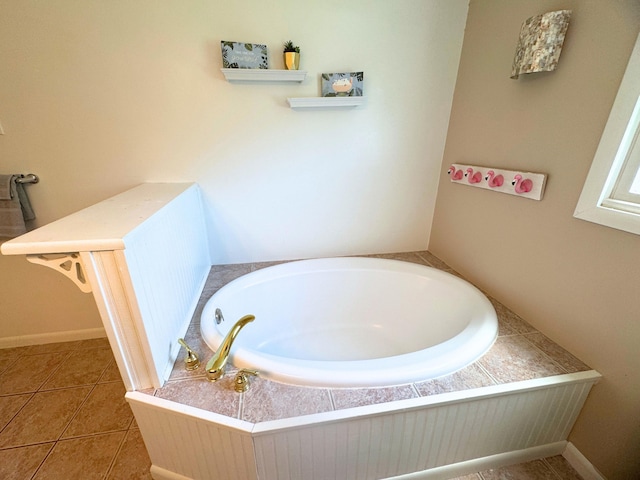 10073 Mcafee Dr, Montrose, MI 48457 - bathroom with a bath, baseboards, and tile patterned floors