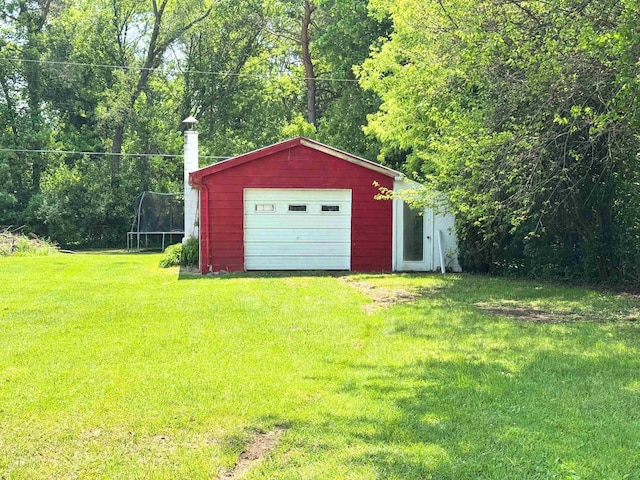 10073 Mcafee Dr, Montrose, MI 48457 - detached garage with a trampoline and driveway