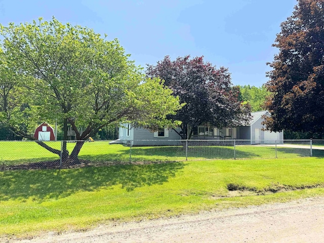 10073 Mcafee Dr, Montrose, MI 48457 - view of yard featuring a garage and an outdoor structure
