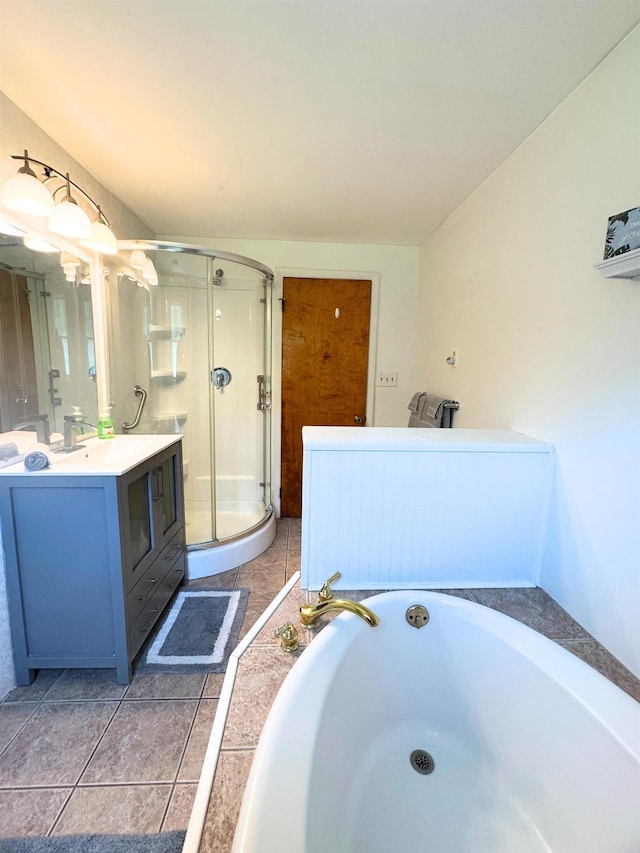 10073 Mcafee Dr, Montrose, MI 48457 - full bathroom with vanity, a stall shower, a bath, and tile patterned flooring