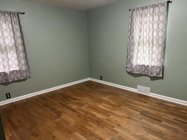 201 Goodell Ave, Colon, MI 49040 - unfurnished room with wood finished floors and baseboards