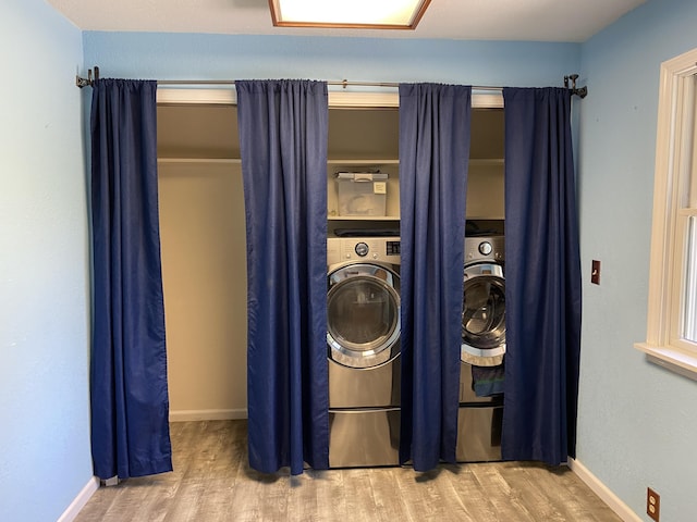 201 Goodell Ave, Colon, MI 49040 - laundry area featuring wood finished floors and washer / dryer