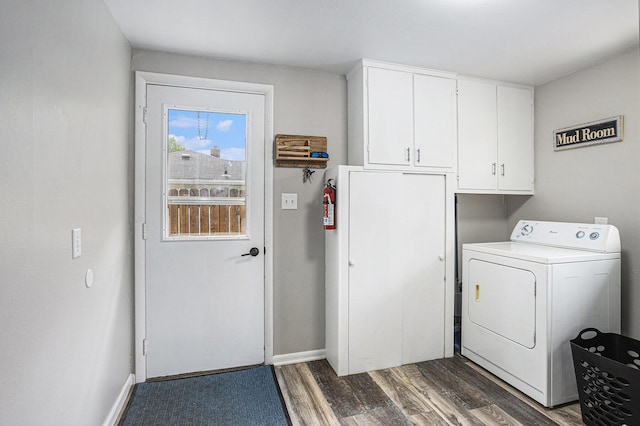1012 E Hatch St, Sturgis, MI 49091 - laundry area with washer / clothes dryer, cabinet space, dark wood-type flooring, and baseboards