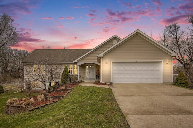 1200 Schuring Rd, Portage, MI 49024 - view of front facade with concrete driveway, a garage, a yard, and a shingled roof