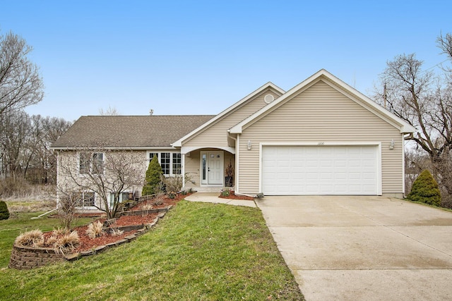 1200 Schuring Rd, Portage, MI 49024 - view of front of home with a garage, driveway, a front yard, and a shingled roof