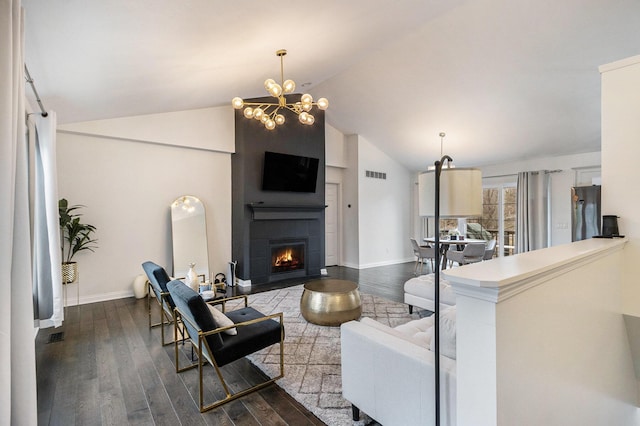 1200 Schuring Rd, Portage, MI 49024 - living area with lofted ceiling, dark wood finished floors, a fireplace, baseboards, and a chandelier