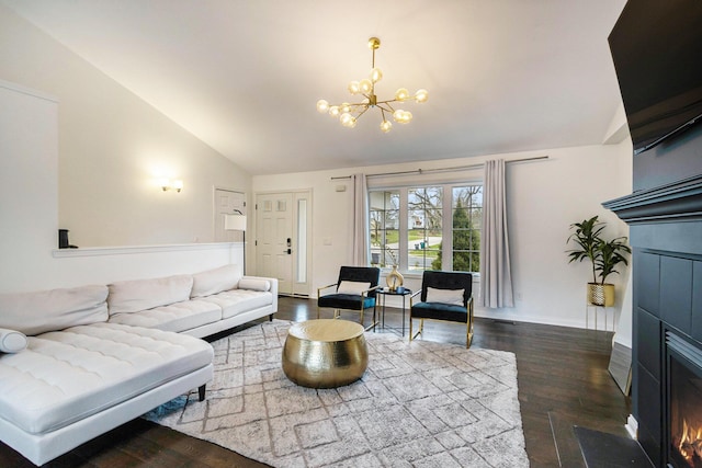 1200 Schuring Rd, Portage, MI 49024 - living room featuring a chandelier, dark wood-type flooring, high vaulted ceiling, and baseboards