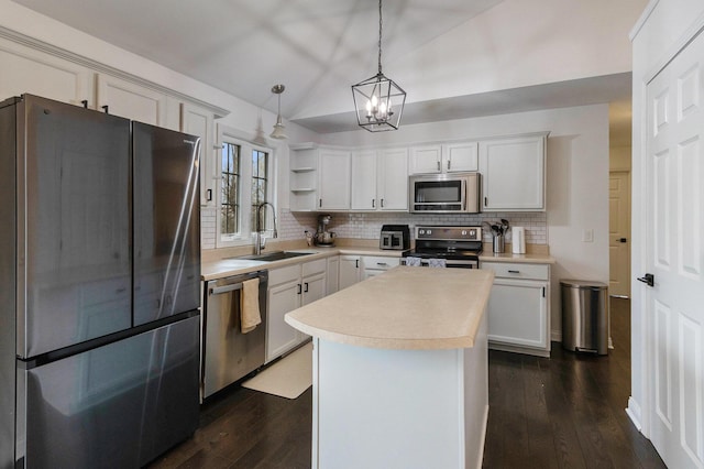 1200 Schuring Rd, Portage, MI 49024 - kitchen with stainless steel appliances, a sink, vaulted ceiling, open shelves, and tasteful backsplash