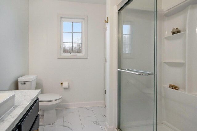 1200 Schuring Rd, Portage, MI 49024 - full bath with a shower stall, vanity, baseboards, marble look tiles, and toilet