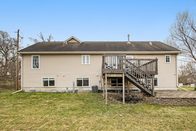 1200 Schuring Rd, Portage, MI 49024 - back of property with a deck, a lawn, central AC, and stairway
