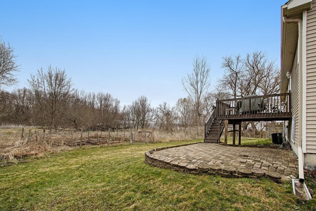 1200 Schuring Rd, Portage, MI 49024 - view of grassy yard with stairway, a patio, a deck, and central air condition unit