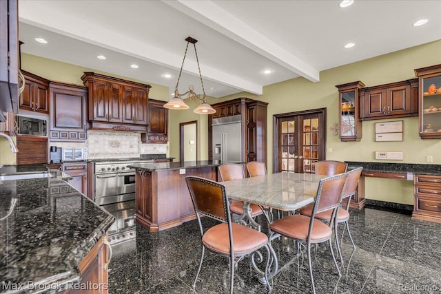 985 James K Blvd, Pontiac, MI 48341 - kitchen with granite tiled floors, built in appliances, recessed lighting, a sink, and beamed ceiling