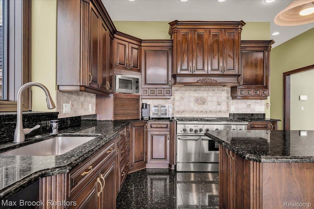 985 James K Blvd, Pontiac, MI 48341 - kitchen with stainless steel appliances, a sink, granite tiled floors, dark stone countertops, and backsplash