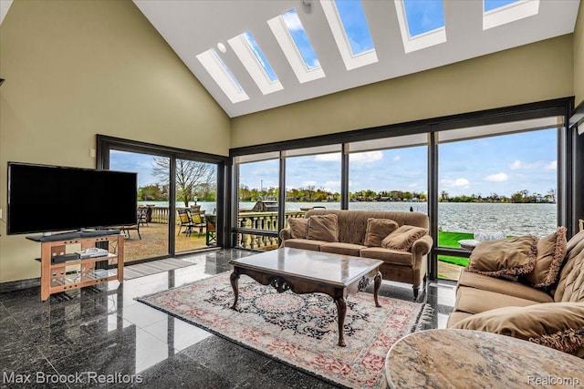 985 James K Blvd, Pontiac, MI 48341 - living area with high vaulted ceiling, a skylight, granite tiled floors, a water view, and baseboards