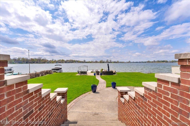 985 James K Blvd, Pontiac, MI 48341 - view of green lawn with a dock and a water view