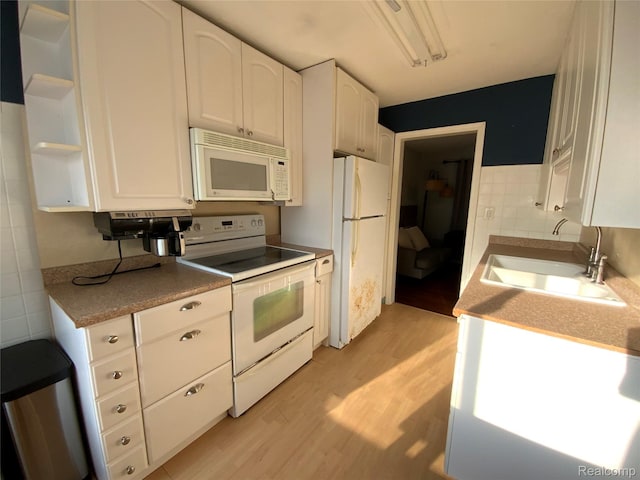 3255 Goodrich St, Ferndale, MI 48220 - kitchen with white appliances, light wood-style floors, white cabinets, and open shelves