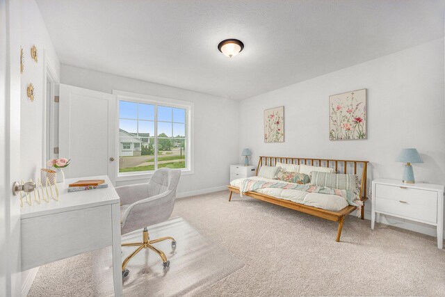 LOT166 Wren Ct, Caledonia, MI 49316 - bedroom featuring light colored carpet, an office area, and baseboards