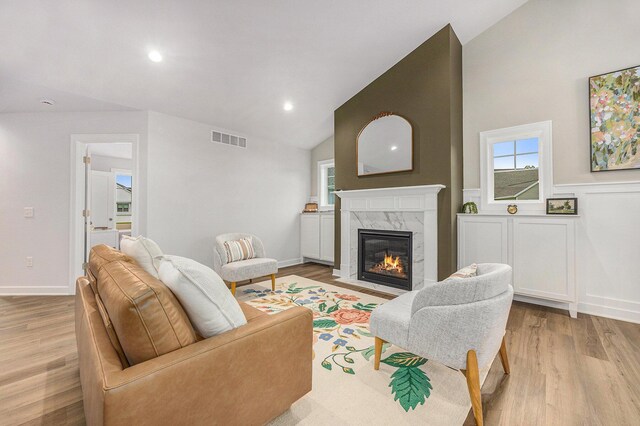 LOT166 Wren Ct, Caledonia, MI 49316 - living room with a premium fireplace, light wood finished floors, high vaulted ceiling, recessed lighting, and baseboards