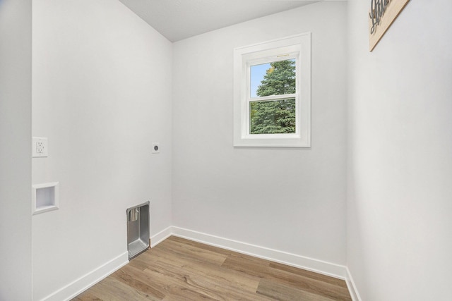 LOT166 Wren Ct, Caledonia, MI 49316 - washroom featuring hookup for an electric dryer, baseboards, and light wood-style flooring