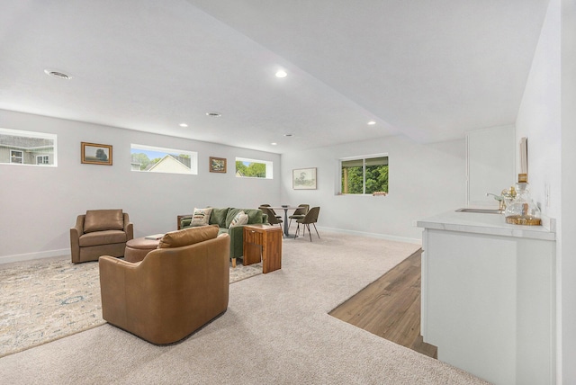 LOT166 Wren Ct, Caledonia, MI 49316 - living room featuring recessed lighting, baseboards, carpet flooring, wood finished floors, and bar