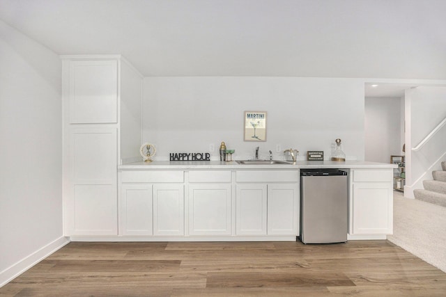 LOT166 Wren Ct, Caledonia, MI 49316 - indoor wet bar with stainless steel dishwasher, stairs, light wood-style floors, and recessed lighting