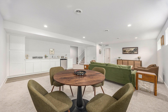 LOT166 Wren Ct, Caledonia, MI 49316 - dining room with light carpet, stairway, bar area, baseboards, and recessed lighting