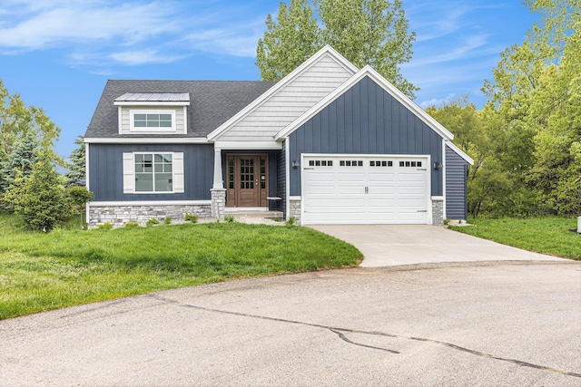 LOT166 Wren Ct, Caledonia, MI 49316 - view of front facade with board and batten siding, an attached garage, a front yard, concrete driveway, and stone siding
