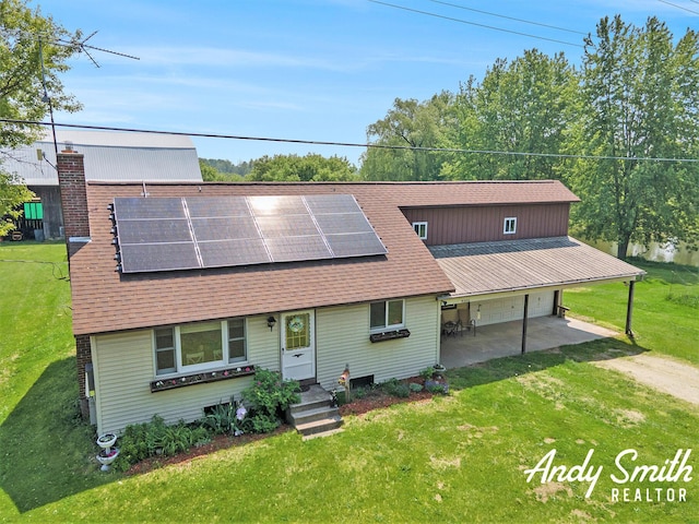 9386 N Vandecar Rd, Farwell, MI 48622 - view of front of home featuring a front lawn, solar panels, and driveway