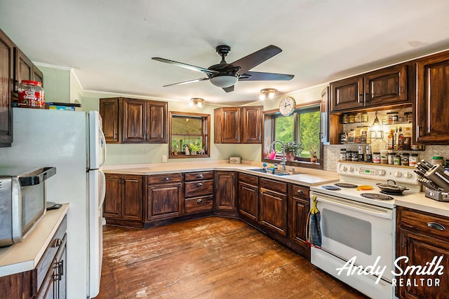 9386 N Vandecar Rd, Farwell, MI 48622 - kitchen featuring white appliances, ceiling fan, a sink, light countertops, and dark wood-style flooring
