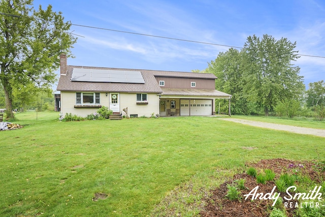 9386 N Vandecar Rd, Farwell, MI 48622 - view of front of house featuring a front lawn, a chimney, dirt driveway, roof mounted solar panels, and roof with shingles